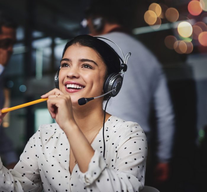 Cropped shot of an attractive young woman looking thoughtful while working in a call center.